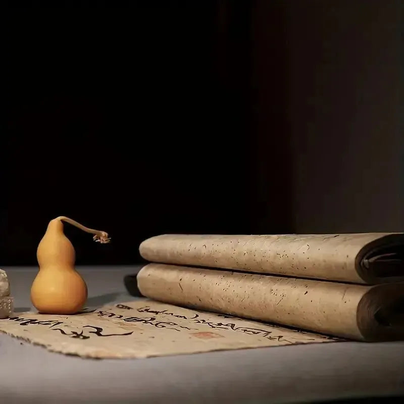 Aged, weathered Pirate paper scrolls on a table with a small gourd, ready for maps or letters.