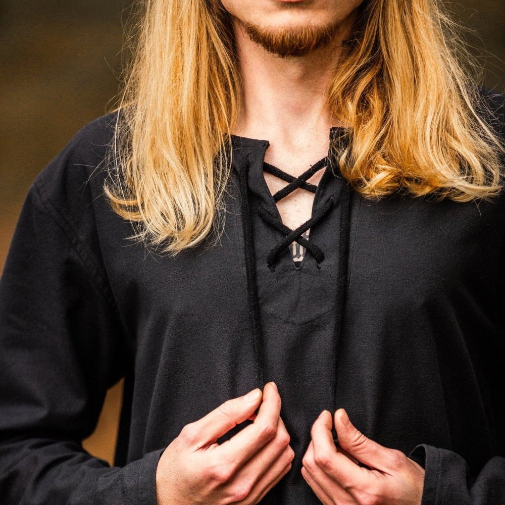 Black cotton Pirate shirt with lace-up collar and long sleeves, worn by a person with long blonde hair.
