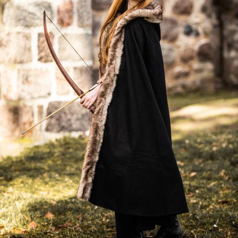 Black hooded Pirate cape made of wool blend with luxurious faux fur trim, worn by a person holding a bow.