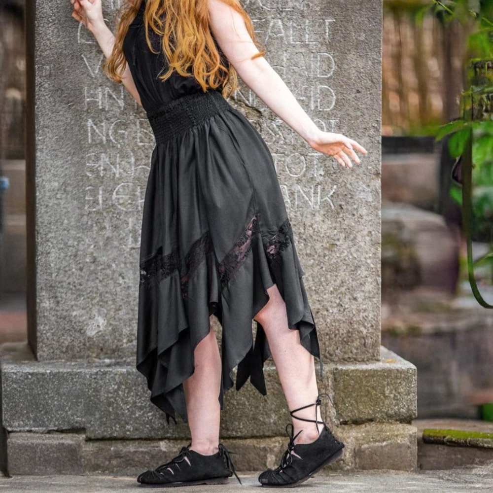 Black Pirate viscose skirt with elastic waistband and lace panels at the asymmetrical hem.