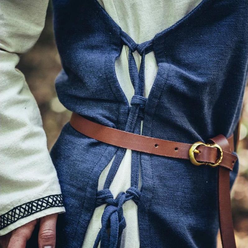 Blue cotton Pirate overdress with adjustable side ties and a brown leather belt.
