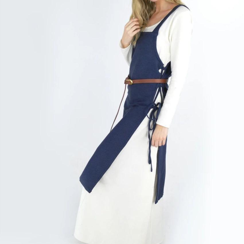 Blue cotton Pirate overdress with wide straps and adjustable side ties, worn over a white underdress.