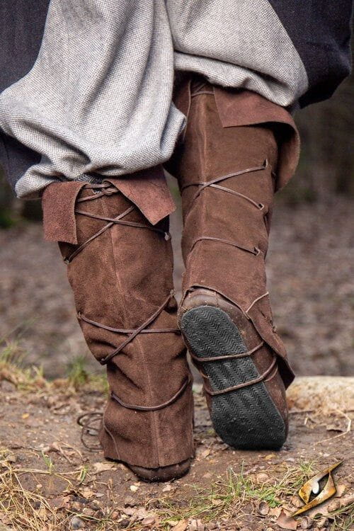 Brown suede Pirate gaiters with dual lacing and under-sole straps, covering legs from ankle to knee.