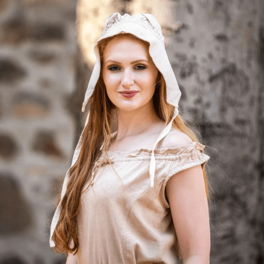 Woman wearing a natural off-white cotton Pirate coif, protecting her head and neck.