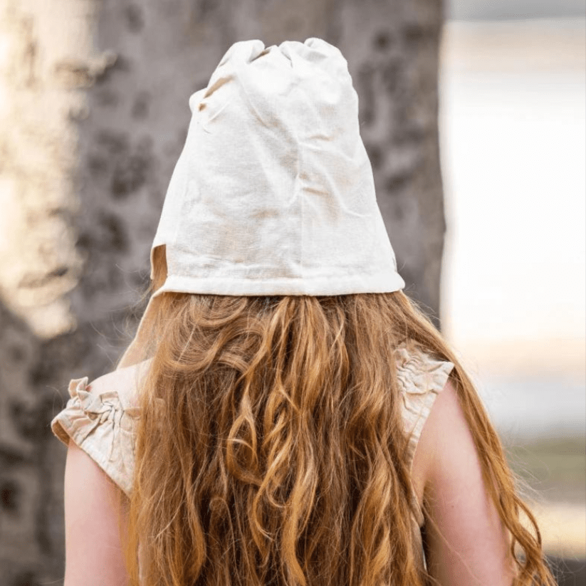 Natural off-white cotton Pirate coif on a woman with long red hair, protecting her head and neck.