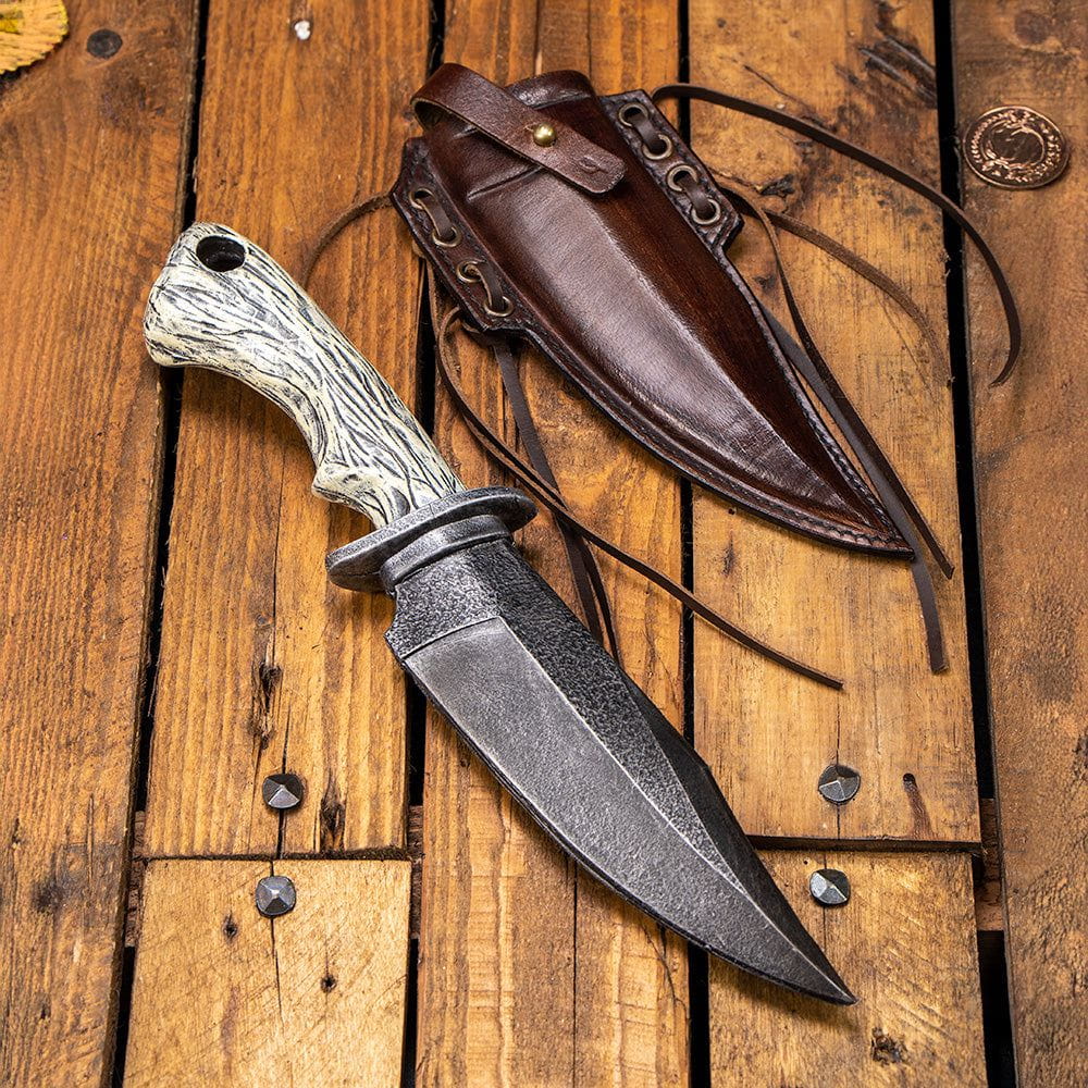 Brown hardened full-grain leather Pirate knife scabbard with straps, next to a LARP combat knife.