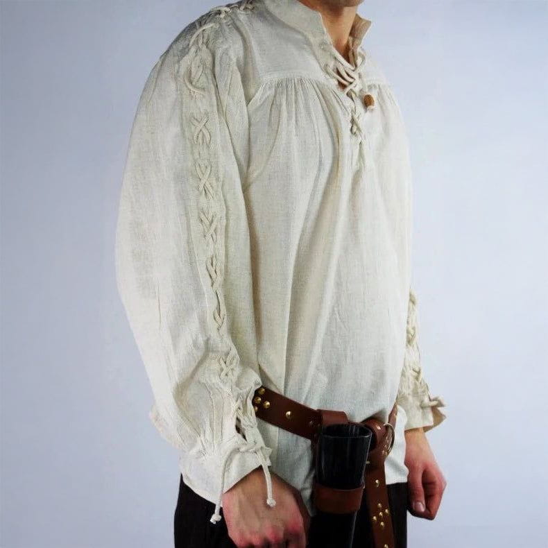 Cream cotton-linen Pirate shirt with high collar, front lace-up, and tie sleeves with braided detail.