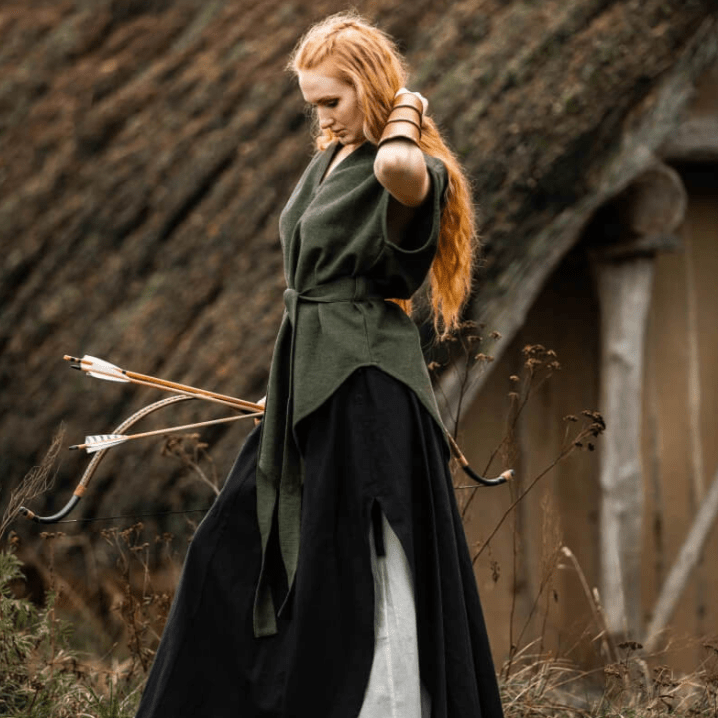 Pirate woman in a green hooded cotton tunic with belt, over a black skirt, holding a bow and arrows.