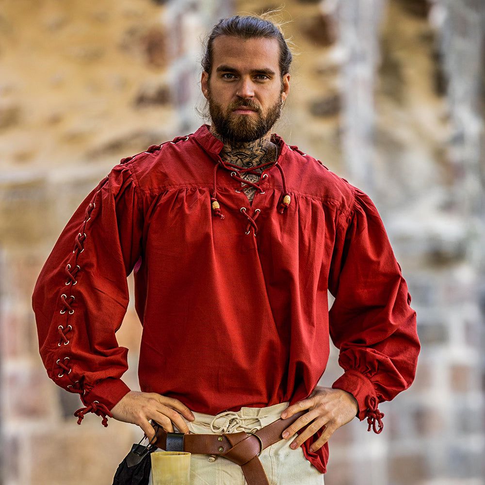 Model wearing red pirate shirt with laced sleeves and short collar