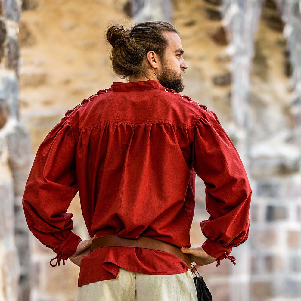 Rear view of Model wearing red pirate shirt with laced sleeves