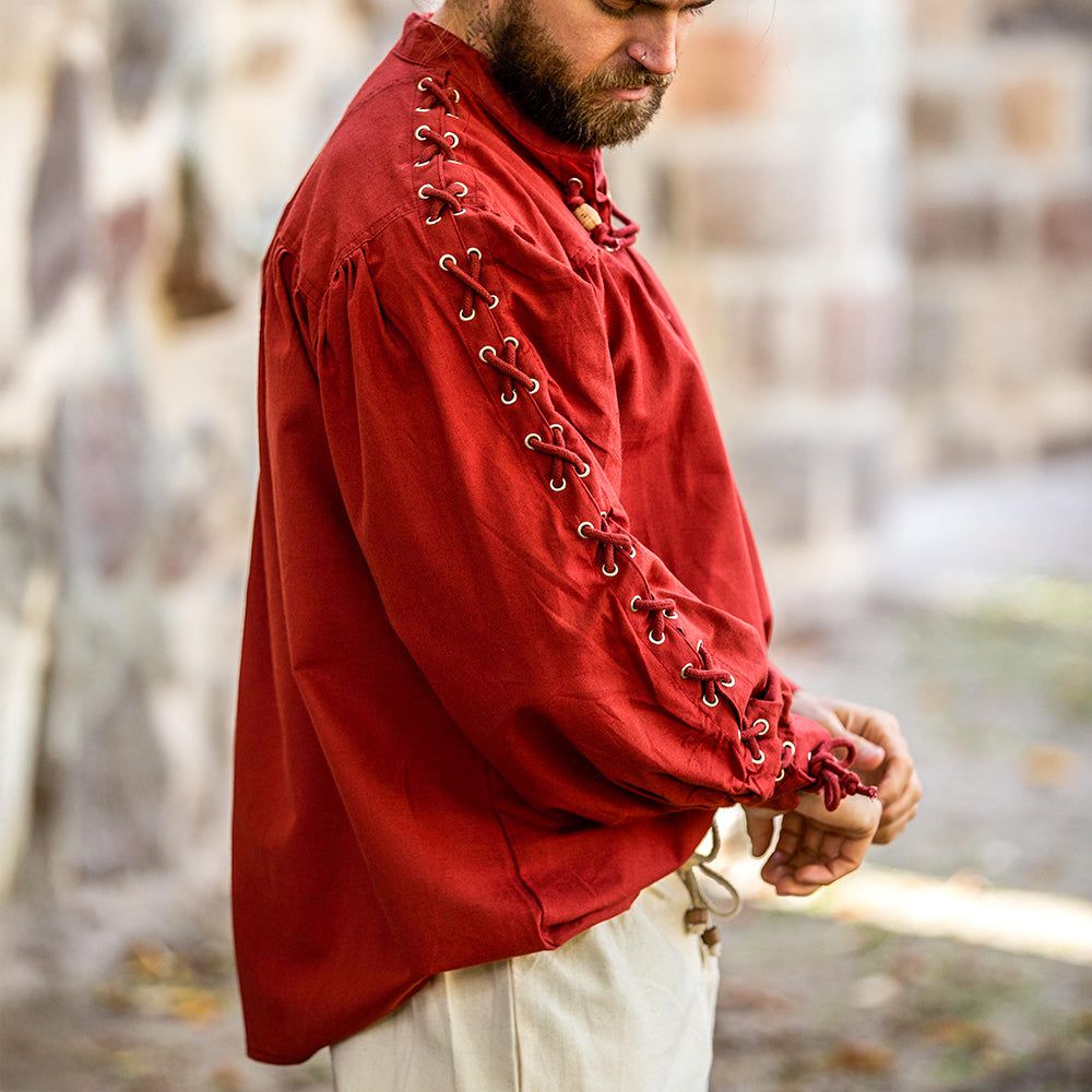 side view - model wearing red pirate shirt with laced sleeves
