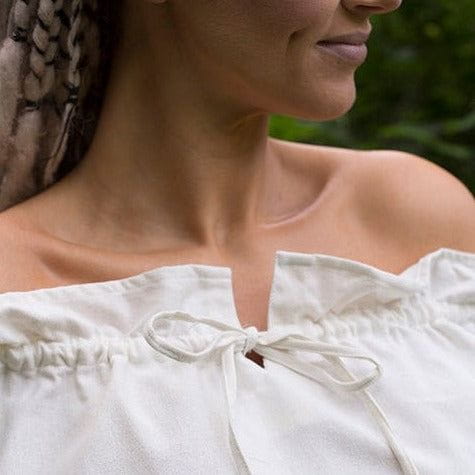 White loose-fit Pirate shirt with adjustable drawstring neckline, made from slightly sheer crepe cotton.