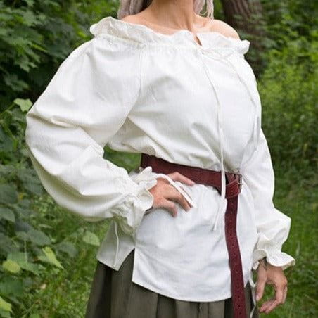 White loose-fit cotton Pirate shirt with ruffled neckline and cuffs, tied with a brown belt.