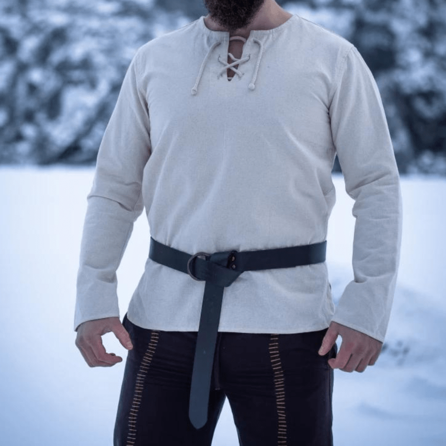Natural cotton long-sleeve Pirate tunic with lace-up collar and black belt, worn by a man in a snowy setting.
