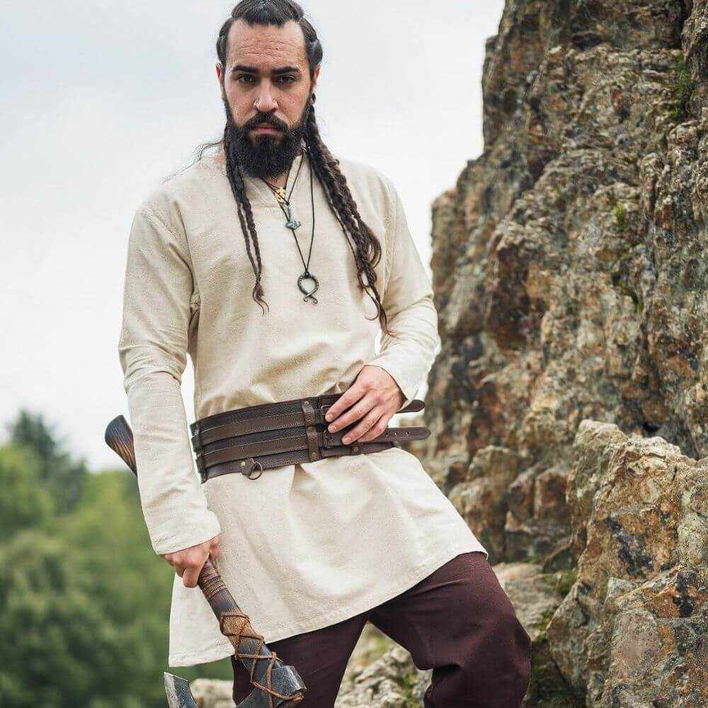 Natural linen Pirate tunic, thigh-length, with a classic neckline, worn by a bearded man holding an axe.