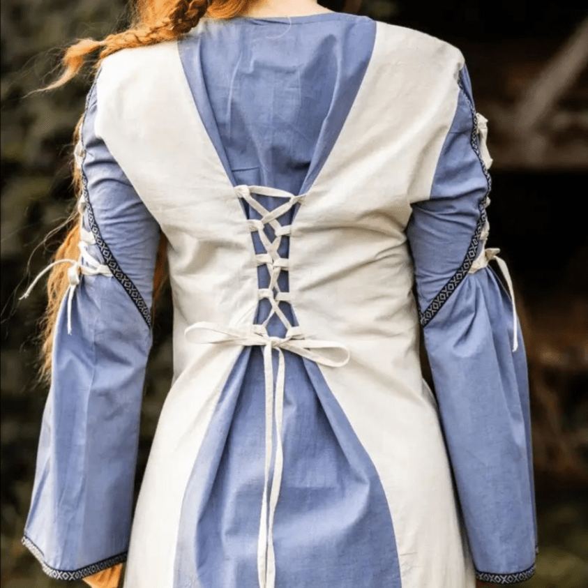 Pirate natural and blue cotton gown with laced back, trumpet sleeves, and floral borders.
