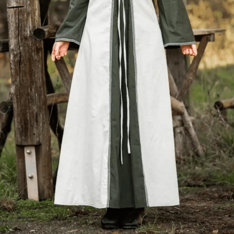 Natural and green Pirate gown in hand-woven cotton with long trumpet sleeves and laced V-neckline.