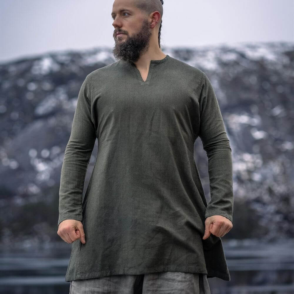 Olive green linen Pirate tunic with a classic V-neck, thigh-length cut, worn by a man.