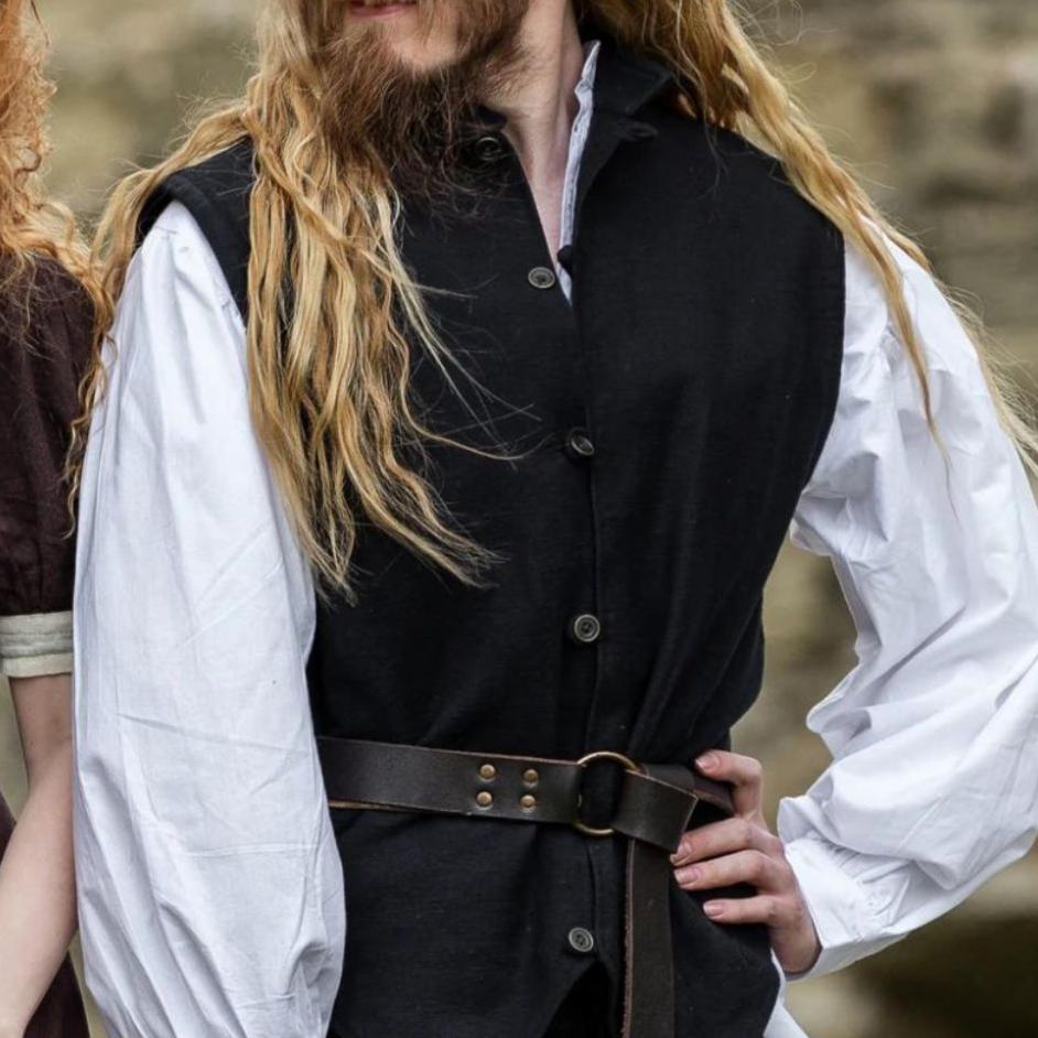 Black hand-woven cotton Pirate button-up vest with metal buttons, worn over a white shirt with a brown belt.