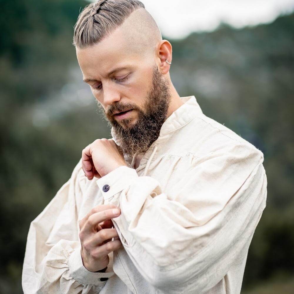 Natural white Pirate shirt with lace-up collar and buttoned cuffs, worn by a man.