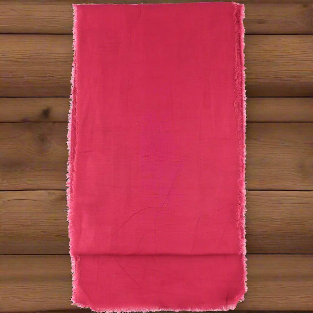 Burgundy red Pirate sash, 100% cotton with raw unhemmed edges, 140x9.5 inches, on wood.