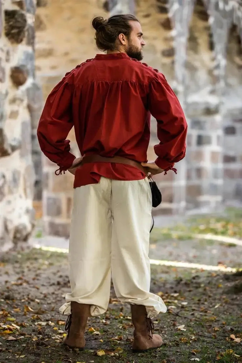 Red Pirate Shirt with adjustable tie sleeves, classic stand-up collar, and lace-up front, worn by a man.