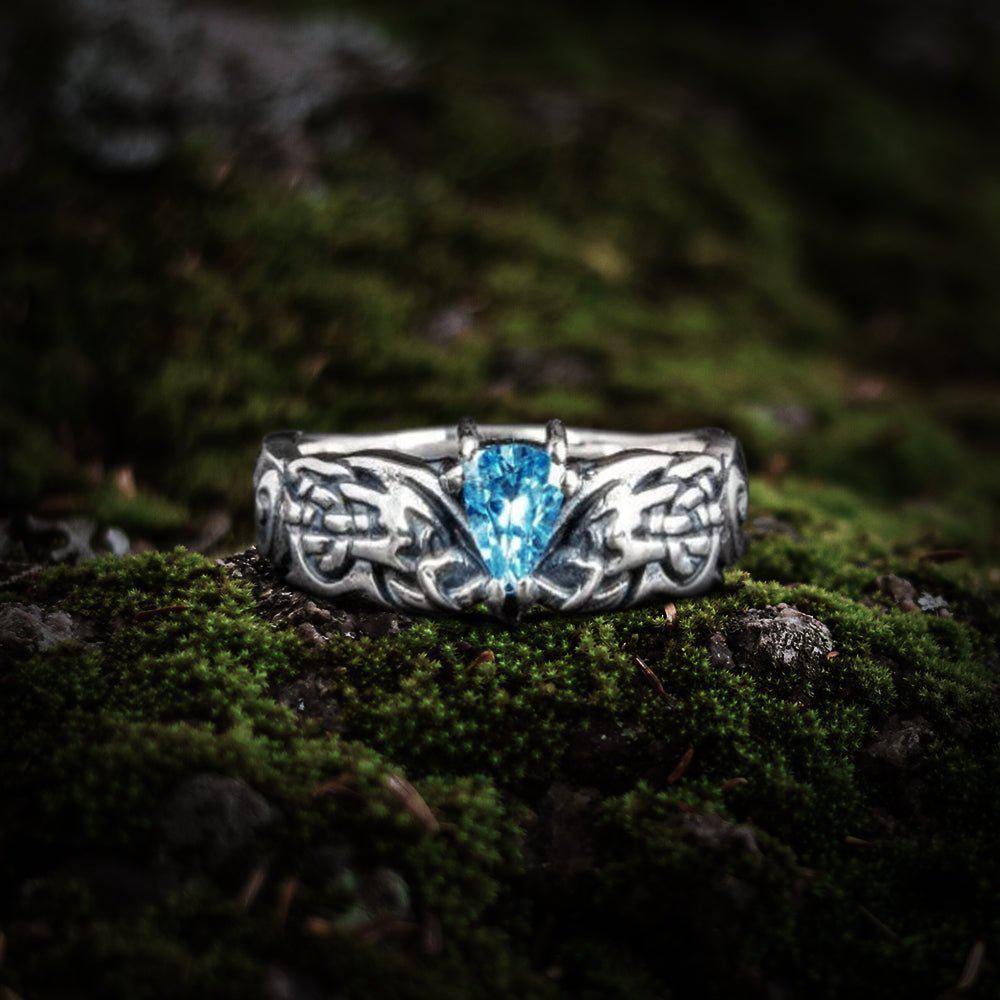 Sterling silver Pirate ring with a brilliant blue cubic zirconia and detailed ornamental band.