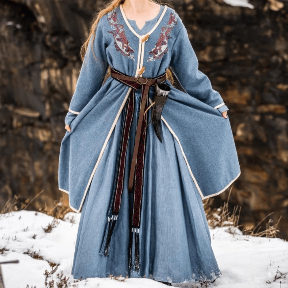Woman wearing a blue wool Pirate coat, front view
