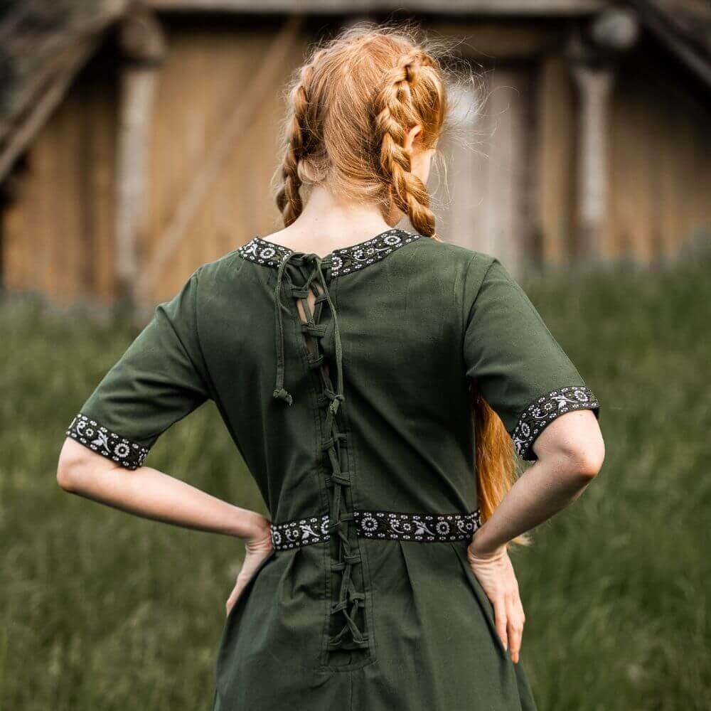 Close-up of embroidered trim on the green Pirate ladies dress