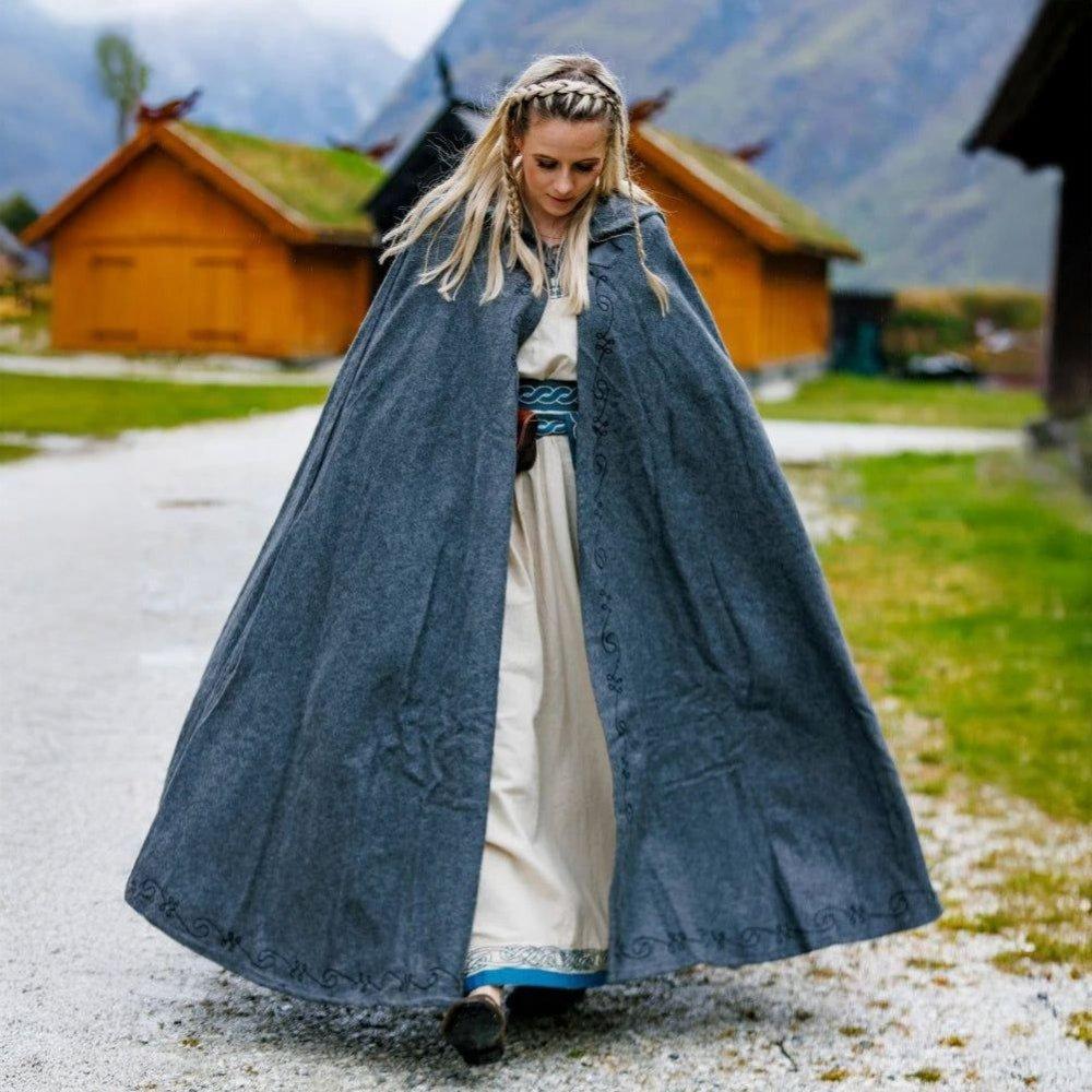 Long gray wool Pirate cloak with a short hood and subtle embroidered trim, worn by a woman.