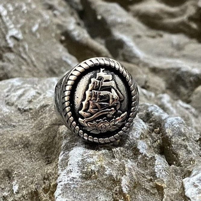 Stainless steel Pirate Man o' War ring with a detailed ship, full sails, and ocean waves design.