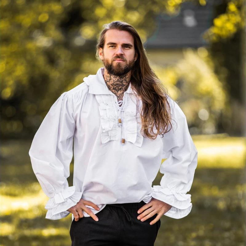Man wearing a white cotton Pirate shirt with ruffles, puffed sleeves, and wooden buttons.