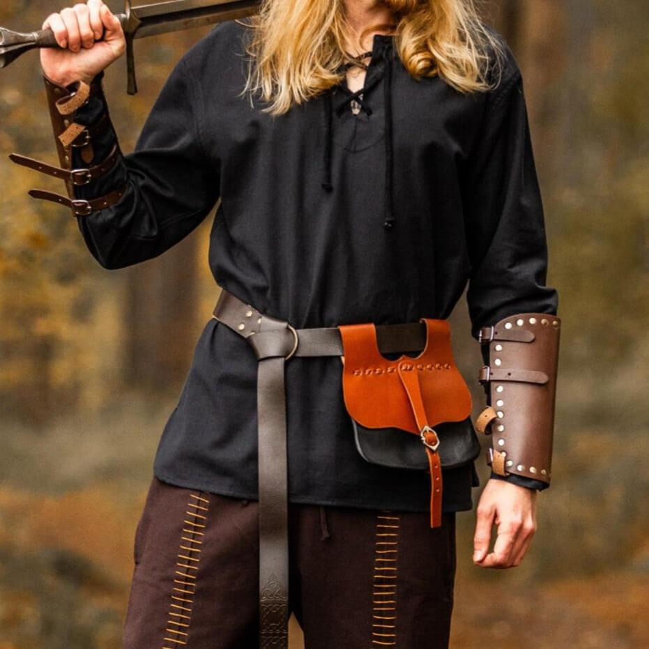 Black cotton Pirate shirt with long sleeves and a lace-up collar, worn by a person holding a sword.
