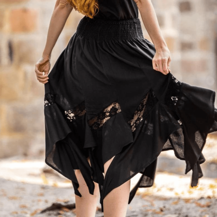 Black Pirate viscose skirt with elastic waistband and flowing lace panels.