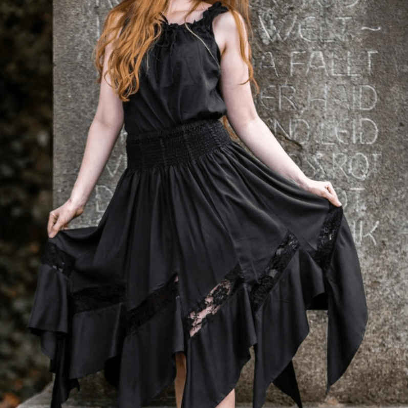 Black Pirate viscose skirt with elastic waistband and lace panels at the asymmetrical hem.