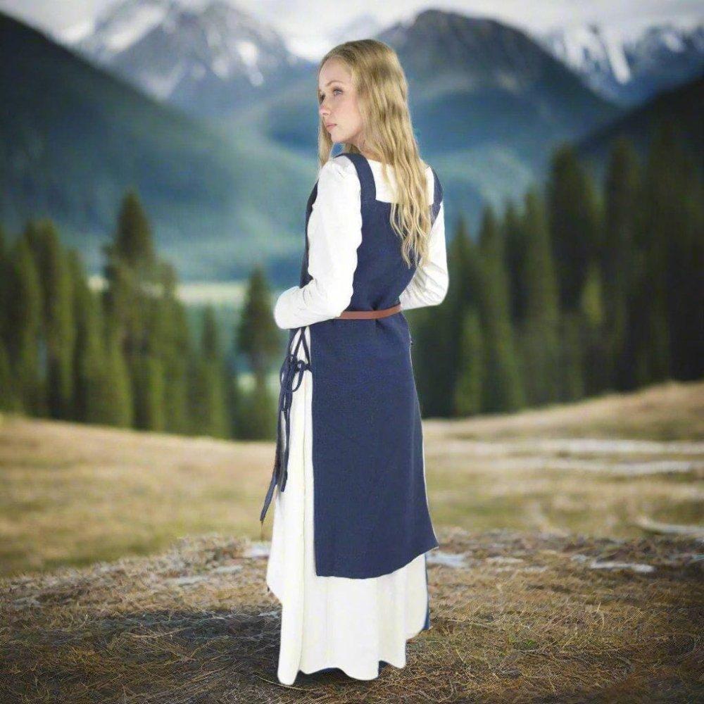 Blue cotton Pirate overdress with wide straps and side ties, worn over a white underdress.