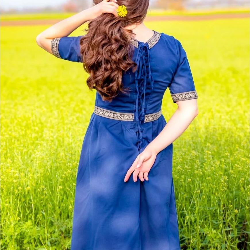 Blue Pirate dress with intricate embroidered borders, short sleeves, and back lacing.