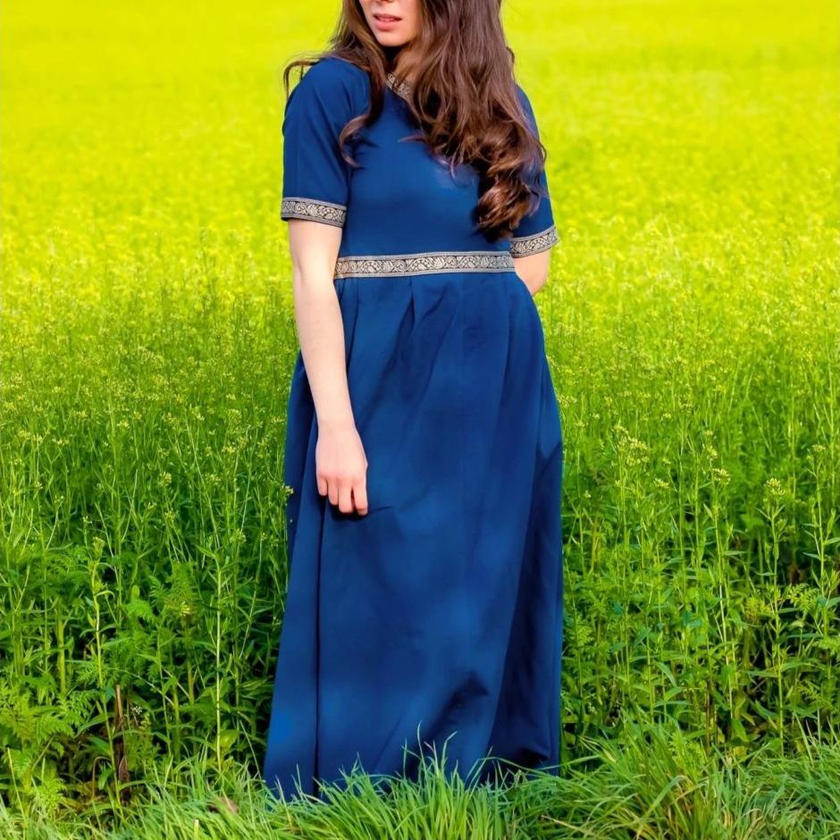 Blue Pirate dress with intricate gold embroidery, short sleeves, and knee-length cut.
