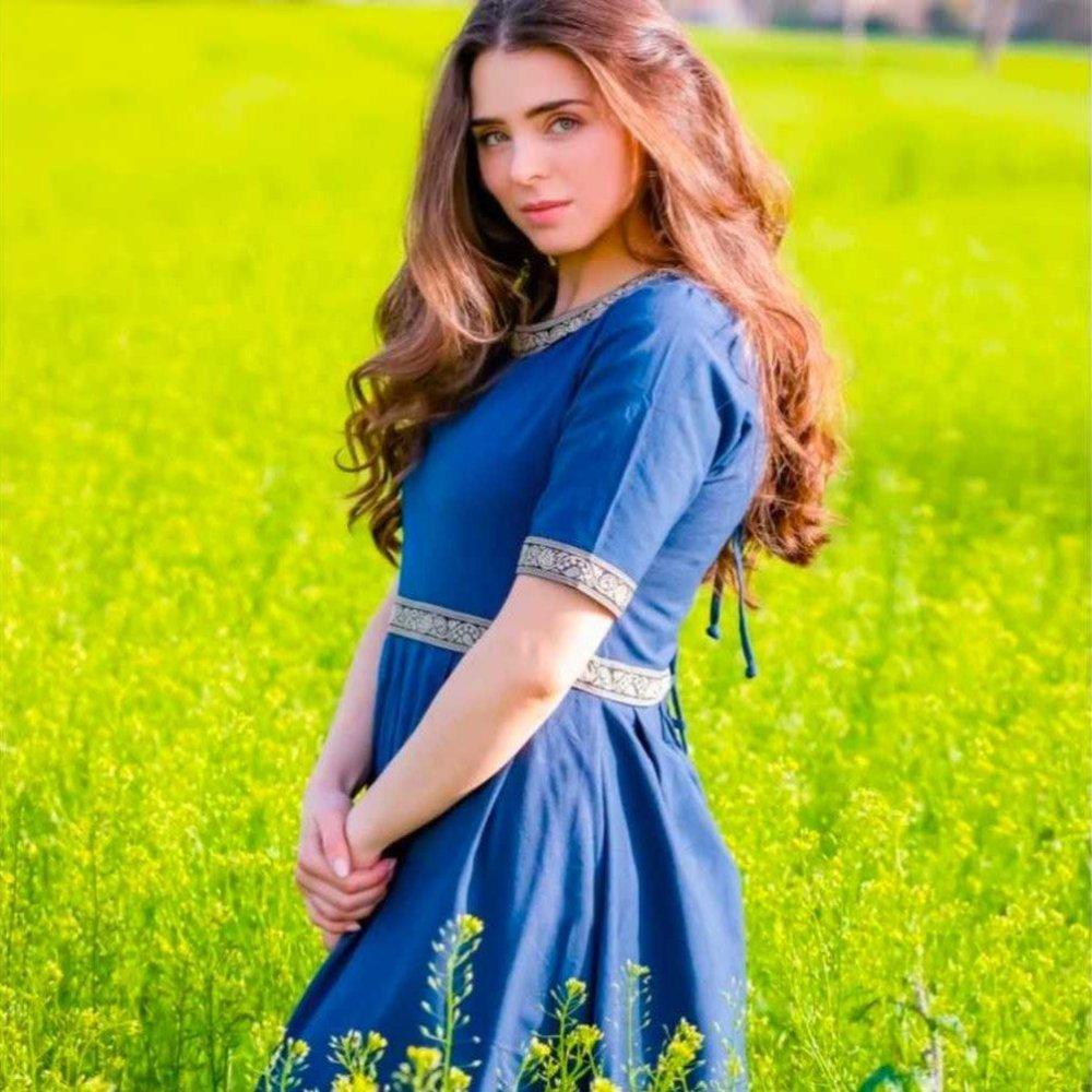 Blue cotton Pirate dress with intricate embroidered borders, short sleeves, and knee-length cut.