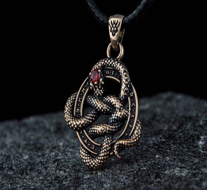 Bronze Pirate snake pendant with red cubic zirconia and runic patterns on a black cord.