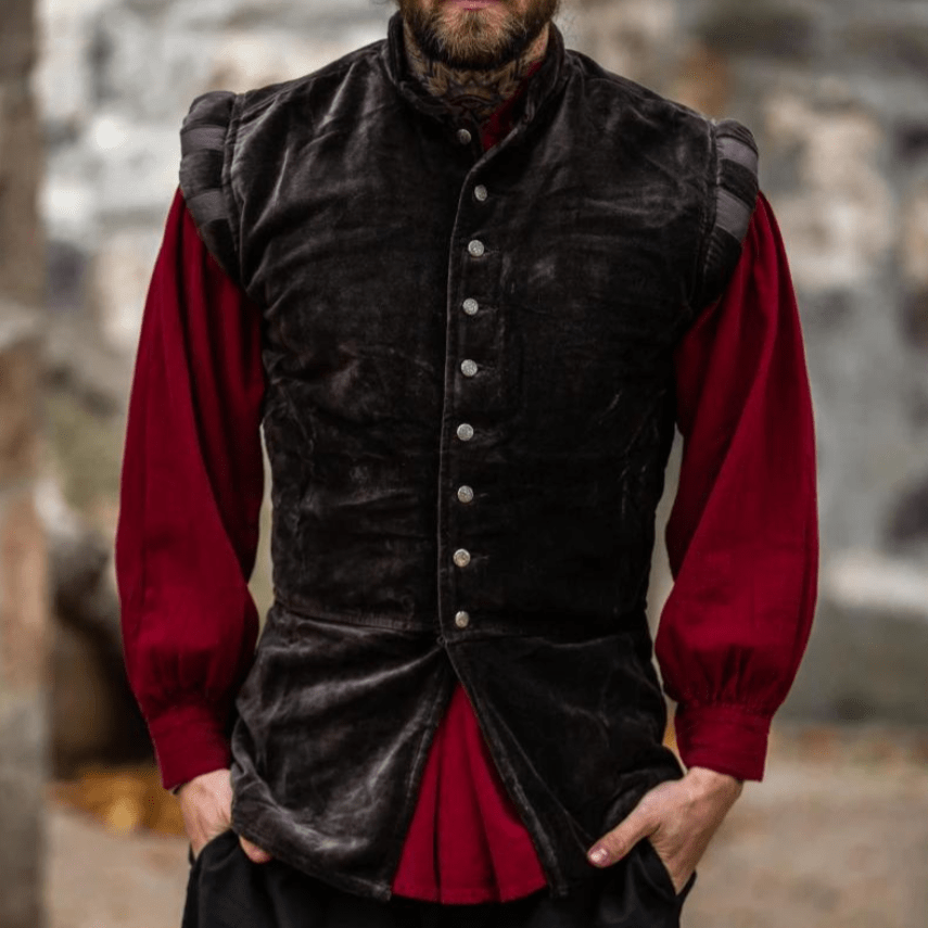 Brown velvet sleeveless Pirate vest with metal buttons and puffed shoulders over a red shirt.