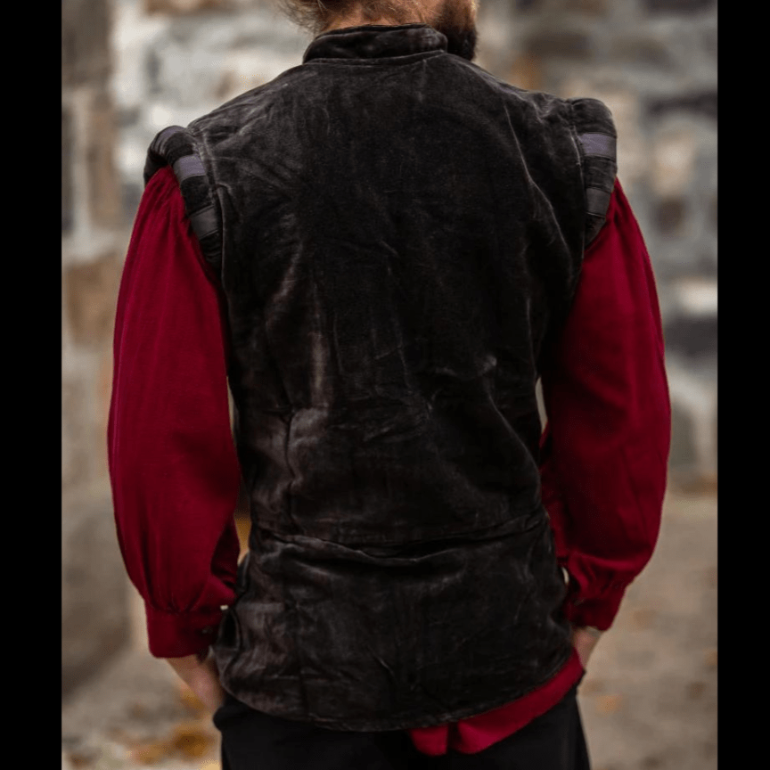 Brown velvet sleeveless Pirate vest with puffed shoulders over a red shirt.