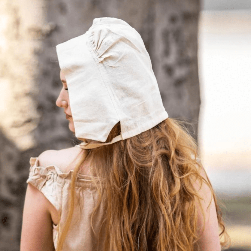 Natural off-white cotton Pirate coif on a woman with long red hair, protecting her head and neck.
