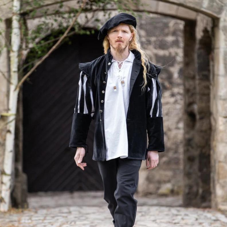 Black velvet Pirate jacket with dramatic slit puff sleeves and wooden buttons over a white shirt.