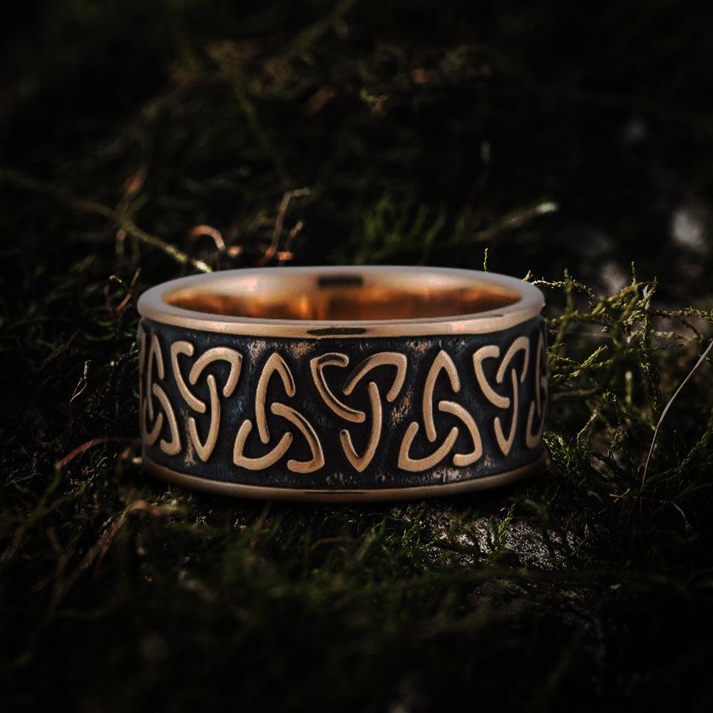 Handcrafted bronze Pirate ring with an aged patina and repeated Triquetra Celtic knot design.