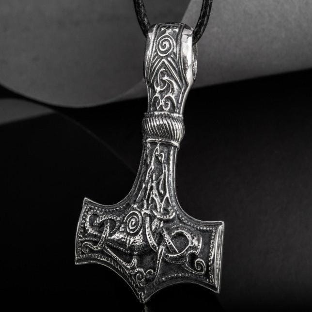 Sterling silver Pirate Thor's Hammer pendant with intricate Mammen-style Norse carvings on a black cord.