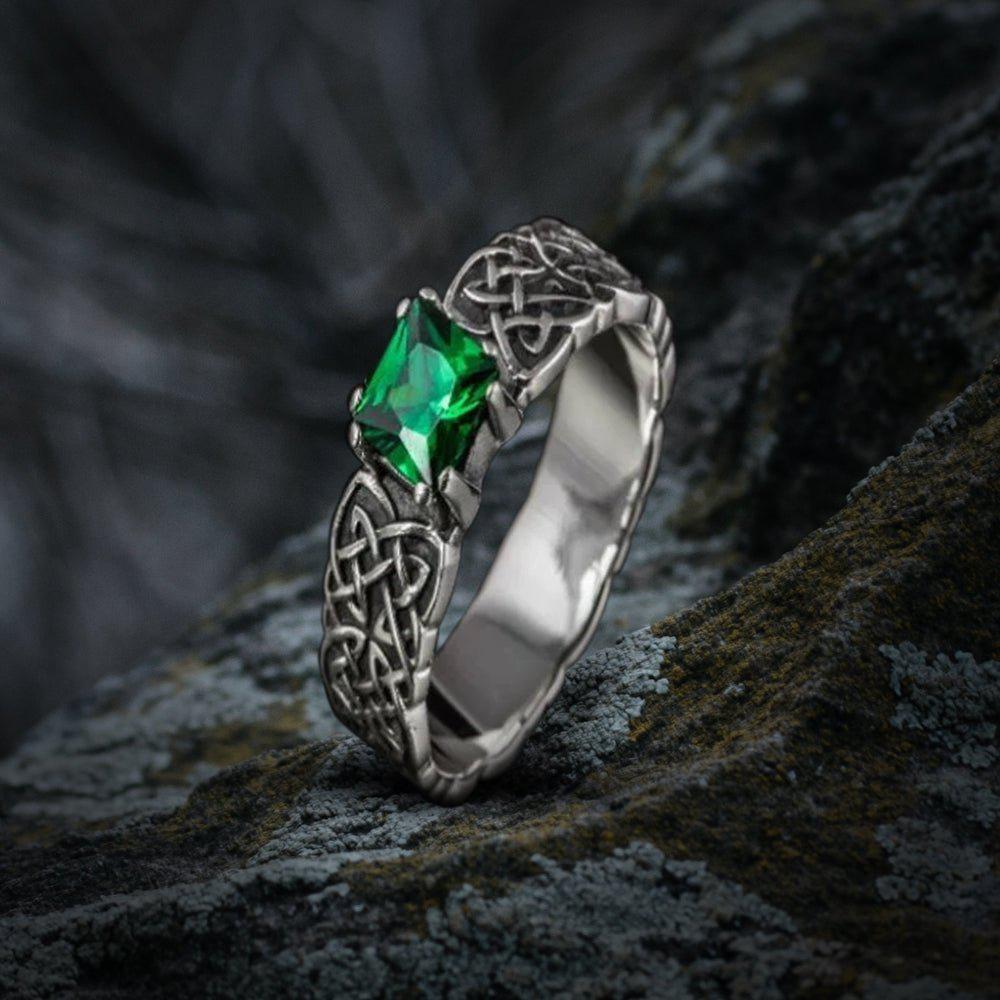 Sterling silver Pirate ring with a vibrant green cubic zirconia and traditional Celtic knotwork.