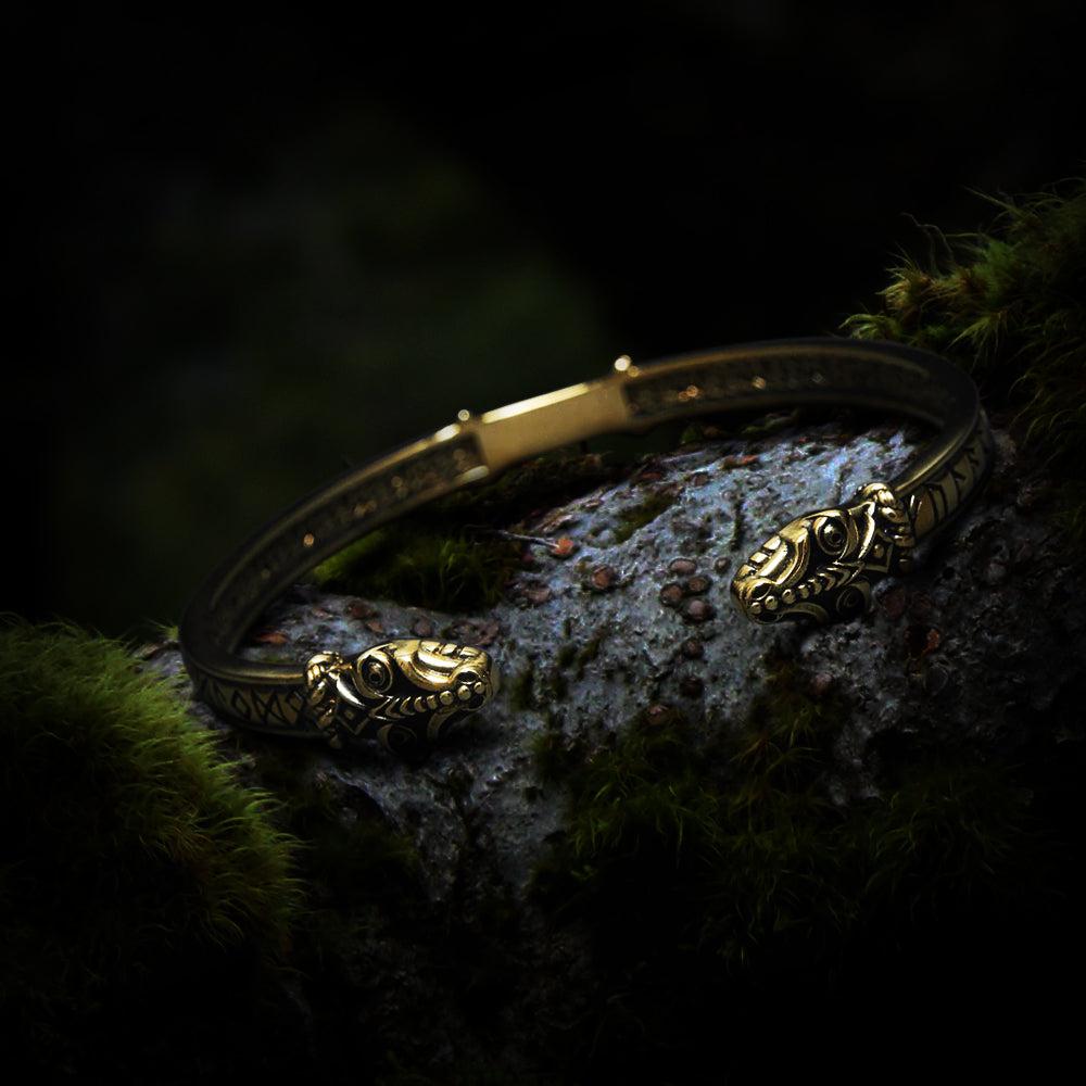 Adjustable bronze Pirate bracelet with Jormungandr serpent heads and Elder Futhark rune engravings.