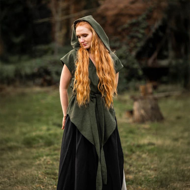 Pirate-style green hooded cotton tunic with belt, worn by a woman with long red hair, in a natural setting.