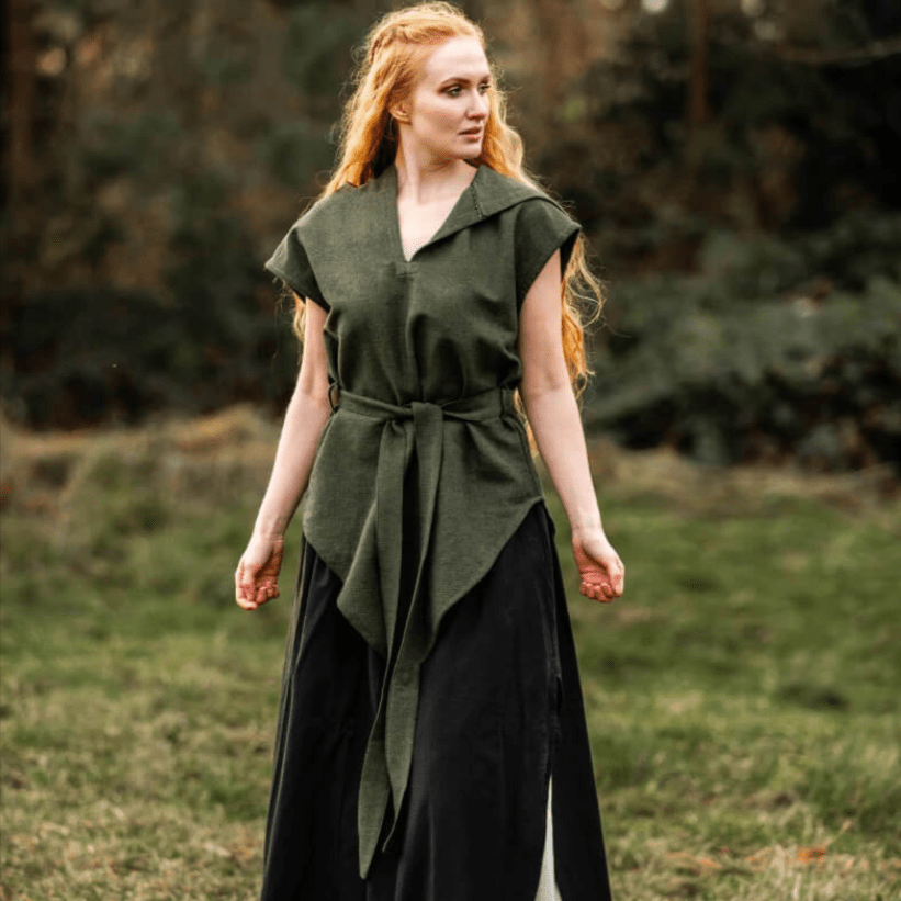 Women's Pirate green hooded cotton tunic with belt, worn over a black skirt in a natural setting.